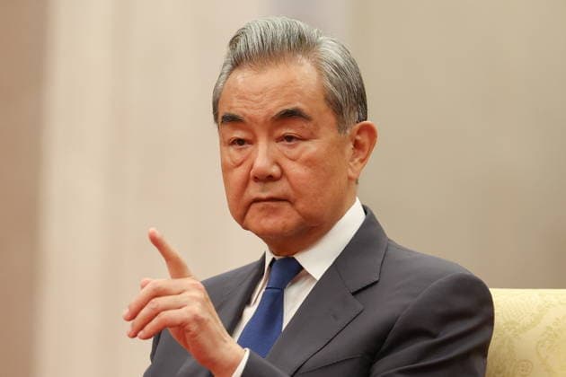 CHINA, BEIJING - MAY 20, 2026: Wang Yi, Foreign Minister of China, and Cai Qi, attends an informal tea meeting at the Great Hall of the People. Putin s official visit marks 25 years since the 2001 Treaty of Good Neighbourliness and Friendly Cooperation between Russia and China. Alexander Kazakov Russian Presidential Press and Information Office TASS  92785231