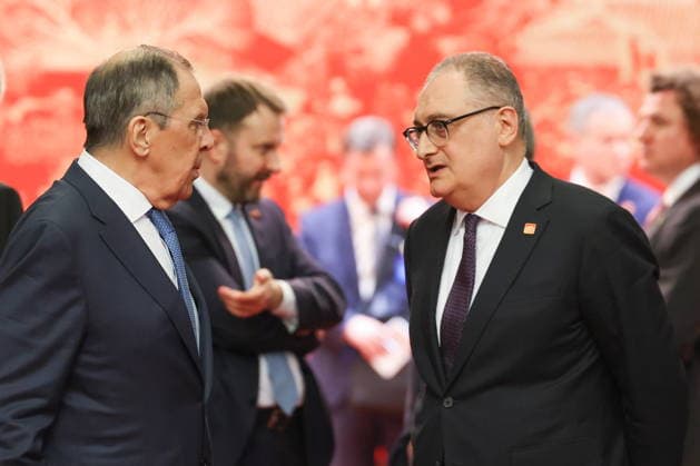 CHINA, BEIJING - MAY 20, 2026: Russia s Foreign Minister Sergei Lavrov and Igor Morgulov (L-R front), Ambassador of Russia, talk ahead of an informal tea meeting at the Great Hall of the People. Vladimir Putin, President of Russia, makes an official visit to mark 25 years since the 2001 Treaty of Good Neighbourliness and Friendly Cooperation between Russia and China Beijing China  - ZUMAt113 20260520_zaa_t113_543 Copyright: xAlexanderxKazakovx