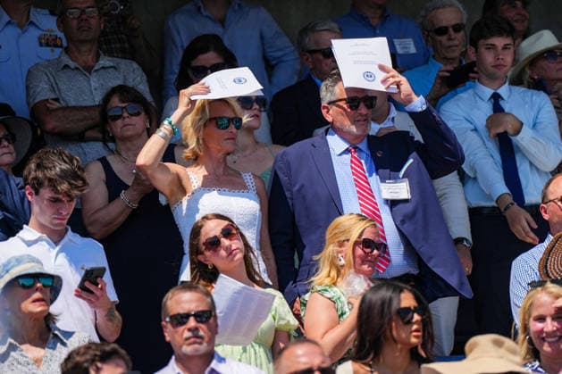 Family members of United States Coast Guard cadets look attend their graduation ceremony in New London, Connecticut on Wednesday, May 20, 2026. President Donald Trump will deliver the commencement address.  CONN20260520449 ANGELINAxKATSANIS