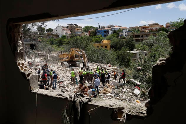 May 20, 2026, Deir Qanoun En Nahr, Tyre District, lebanon: Emergency Operations Center of LebanonÃ¢â‚¬â ¢s Ministry of Public Health announced that an Israeli airstrike on the southern Lebanese town of Deir Qanoun al-Nahr on Tuesday, May 19, killed 14 people in a final toll, including four children Ã¢â‚¬ one of them Syrian Ã¢â‚¬ and three women. Lebanese Civil Defense rescue teams continued search and recovery operations for long hours following the strike amid extensive destruction. Deir Qanoun En Nahr lebanon - ZUMAb339 20260520_znp_b339_005 Copyright: xAbdulxKaderxAlxBayx