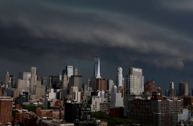 Storm clouds and dark skies move in behind One World Trade Center and Manhattan Skyline bringing thunderstorms in the early evening on Wednesday, May 20, 2026 in New York City.  NYP20260520130 JOHNxANGELILLO