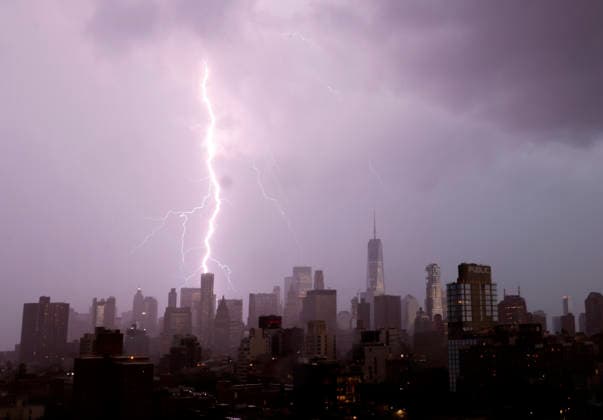 Storm clouds and dark skies move in behind One World Trade Center and Manhattan Skyline bringing thunderstorms and lightning in the early evening on Wednesday, May 20, 2026 in New York City.  NYP20260520131 JOHNxANGELILLO