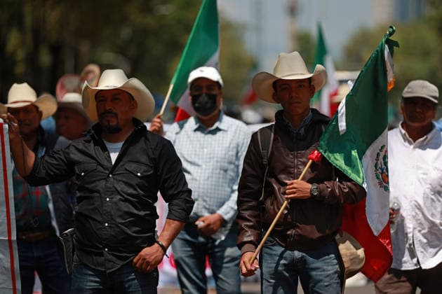Transport workers and farmers lead rally in Mexico City MEXICO CITY, MEXICO - MAY 20: Transport workers and farmers hold Mexican flags as they take part in a rally to demand more security on highways, in Mexico City, Mexico on May 20, 2026. Under the slogan Without support for farmers, there will be no World Cup, hundreds of transport workers and farmers from several states across Mexico gathered to demand greater security nationwide, particularly on highways where criminal activity has increased, as well as more government support for the agricultural sector. Daniel Cardenas Anadolu Mexico City Mexico. Editorial use only. Please get in touch for any other usage.  Copyright: x2026xAnadoluxDanielxCardenasx
