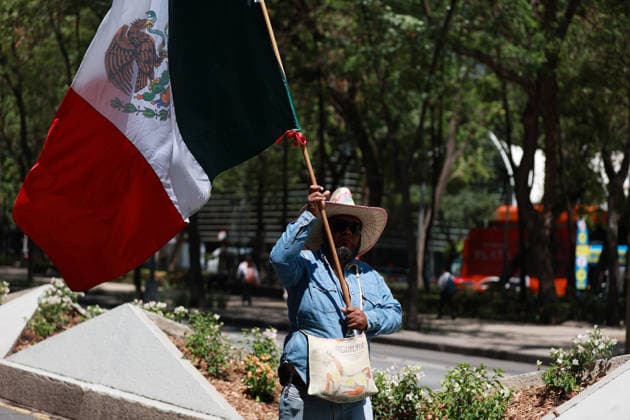 Transport workers and farmers lead rally in Mexico City MEXICO CITY, MEXICO - MAY 20: A transport worker holds a Mexican flags as he takes part in a rally to demand more security on highways, in Mexico City, Mexico on May 20, 2026. Under the slogan Without support for farmers, there will be no World Cup, hundreds of transport workers and farmers from several states across Mexico gathered to demand greater security nationwide, particularly on highways where criminal activity has increased, as well as more government support for the agricultural sector. Daniel Cardenas Anadolu Mexico City Mexico. Editorial use only. Please get in touch for any other usage.  Copyright: x2026xAnadoluxDanielxCardenasx