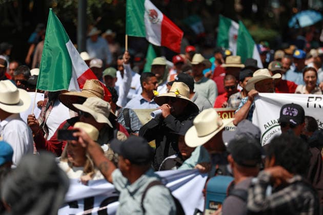 Transport workers and farmers lead rally in Mexico City MEXICO CITY, MEXICO - MAY 20: Transport workers and farmers hold Mexican flags as they take part in a rally to demand more security on highways, in Mexico City, Mexico on May 20, 2026. Under the slogan Without support for farmers, there will be no World Cup, hundreds of transport workers and farmers from several states across Mexico gathered to demand greater security nationwide, particularly on highways where criminal activity has increased, as well as more government support for the agricultural sector. Daniel Cardenas Anadolu Mexico City Mexico. Editorial use only. Please get in touch for any other usage.  Copyright: x2026xAnadoluxDanielxCardenasx