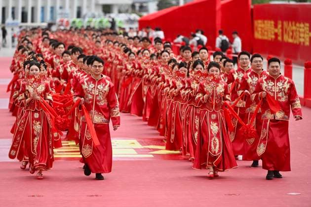 HEFEI, CHINA - MAY 20: Newly-wed couples in traditional Chinese-style clothing attend a group wedding ceremony during 520 I Love You Day on May 20, 2026 in Hefei, Anhui Province of China. Chinese people celebrate 520 I Love You Day as 520 sounds like I love you in Chinese.  Copyright: xChinaxNewsxServicex 111642851293