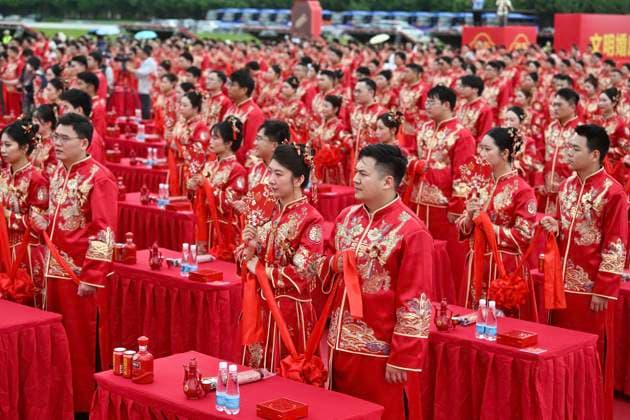 HEFEI, CHINA - MAY 20: Newly-wed couples in traditional Chinese-style clothing attend a group wedding ceremony during 520 I Love You Day on May 20, 2026 in Hefei, Anhui Province of China. Chinese people celebrate 520 I Love You Day as 520 sounds like I love you in Chinese.  Copyright: xChinaxNewsxServicex 111642851297