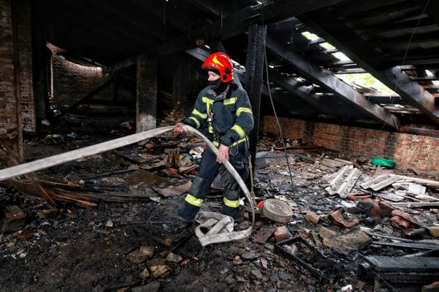 RECORD DATE NOT STATED A firefighter works to eliminate the aftermath of a Russian drone attack in Odesa, Ukraine, on May 18, 2026. As a result of a massive overnight attack by Russian strike drones, several residential buildings in the Prymorskyi and Kyivskyi districts sustained significant damage. Roofs of three-storey buildings were destroyed, while a one-storey house was ruined in another area. Buildings of a city lyceum and a kindergarten were also damaged. Two people, an 11-year-old boy and a 59-year-old man, were injured (Photo by Nina Liashonok Ukrinform) Russian drone attack on Odesa leaves people injured  Copyright: xNinaxLiashonokx