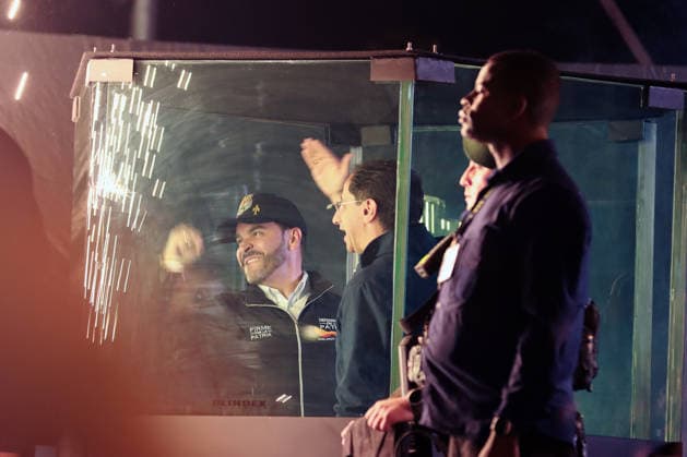 May 20, 2026, Bogota, Cundinamarca, COLOMBIA: Right-wing presidential candidate ABELARDO DE LA ESPRIELLA and his vice-presidential running mate, JOSo° MANUEL RESTREPO address a crowd from behind bulletproof glass during his campaign closing rally ahead of the first-round presidential vote May 31st. The high-security setup serves as a stark visual reminder of Colombia s electoral history, where the threat of political violence has historically cast a shadow over democratic campaigns. Bogota COLOMBIA - ZUMAd225 20260520_znp_d225_002 Copyright: xZoraidaxDiazx