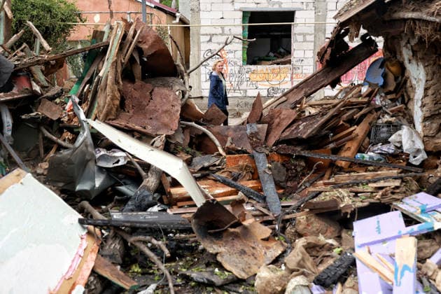 RECORD DATE NOT STATED A woman walks past a private residential house destroyed as a result of a Russian drone attack in Odesa, Ukraine, on May 20, 2026. During the night of May 20, Odesa came under a massive attack by Russian strike drones. The attack caused destruction of residential buildings, fires at commercial facilities, and damage to critical infrastructure. One civilian was injured (Photo by Nina Liashonok Ukrinform) Aftermath of overnight Shahed drone attack on Odesa  Copyright: xNinaxLiashonokx
