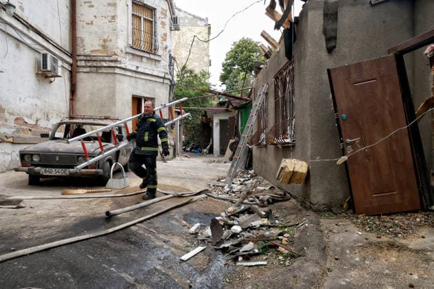 RECORD DATE NOT STATED A firefighter works to eliminate the aftermath of a Russian drone attack in Odesa, Ukraine, on May 18, 2026. As a result of a massive overnight attack by Russian strike drones, several residential buildings in the Prymorskyi and Kyivskyi districts sustained significant damage. Roofs of three-storey buildings were destroyed, while a one-storey house was ruined in another area. Buildings of a city lyceum and a kindergarten were also damaged. Two people, an 11-year-old boy and a 59-year-old man, were injured (Photo by Nina Liashonok Ukrinform) Russian drone attack on Odesa leaves people injured  Copyright: xNinaxLiashonokx