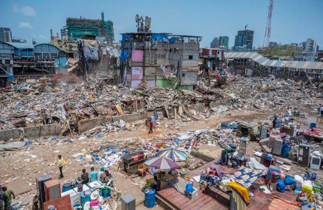 MUMBAI, INDIA - MAY 20: JCB machines in action on second day of an anti-encroachment drive on railway land at Garib Nagar slum in Bandra East on May 20, 2026 in Mumbai, India. (Photo by Satish Bate Hindustan Times) Second Day Of Demolition Drive At Bandra Garib Nagar