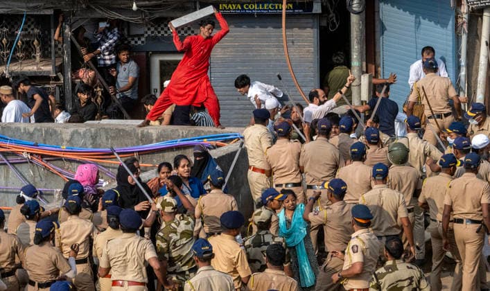 MUMBAI, INDIA - MAY 20: Residents of the Garib Nagar slum in Bandra East clash with police during the second day of an anti-encroachment drive on railway land on May 20, 2026 in Mumbai, India. (Photo by Satish Bate Hindustan Times) Second Day Of Demolition Drive At Bandra Garib Nagar