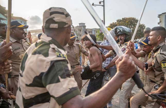 MUMBAI, INDIA - MAY 20: Police use lathi charge to disperse residents after stone pelting on the second day of an anti-encroachment drive at Garib Nagar slum on railway land on May 20, 2026 in Mumbai, India. (Photo by Satish Bate Hindustan Times) Second Day Of Demolition Drive At Bandra Garib Nagar