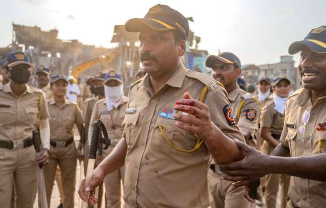 MUMBAI, INDIA - MAY 20: A Policeman injured during stone pelting by residents on the second day of an anti-encroachment drive at Garib Nagar slum on railway land on May 20, 2026 in Mumbai, India. (Photo by Satish Bate Hindustan Times) Second Day Of Demolition Drive At Bandra Garib Nagar