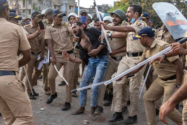 MUMBAI, INDIA - MAY 20: Police detain residents after clash on the second day of an anti-encroachment drive at Garib Nagar slum on railway land on May 20, 2026 in Mumbai, India. (Photo by Satish Bate Hindustan Times) Second Day Of Demolition Drive At Bandra Garib Nagar