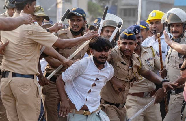 MUMBAI, INDIA - MAY 20: Police detain residents after clash on the second day of an anti-encroachment drive at Garib Nagar slum on railway land on May 20, 2026 in Mumbai, India. (Photo by Satish Bate Hindustan Times) Second Day Of Demolition Drive At Bandra Garib Nagar