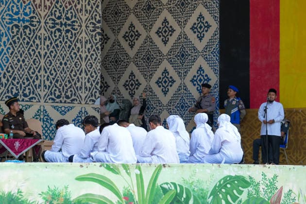 May 21, 2026, Banda Aceh, Aceh, Indonesia: Nine teenagers sit before officers and a preacher who gives them a lecture before being caned in Banda Aceh, Aceh, Indonesia, on Thursday. The canings were imposed after they were found guilty of violating Aceh s Sharia law. They received varying punishments, ranging from dozens to 100 lashes, depending on their violations of Sharia law. Banda Aceh Indonesia - ZUMAi115 20260521_zip_i115_001 Copyright: xMuhammadxIqbalx