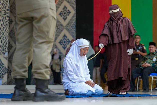 May 21, 2026, Banda Aceh, Aceh, Indonesia: A woman convicted of adultery and adultery was sentenced to 100 lashes in Banda Aceh, Aceh Province, Indonesia, on Thursday. The caning was imposed after she was found guilty of violating Aceh s Sharia law. The public caning served as a lesson and transparency in the implementation of punishment, guaranteed by the Aceh Qanun (Aceh Law), which was passed in 2014. Banda Aceh Indonesia - ZUMAi115 20260521_zip_i115_025 Copyright: xMuhammadxIqbalx