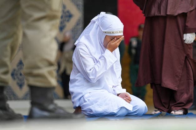 May 21, 2026, Banda Aceh, Aceh, Indonesia: A woman convicted of adultery and adultery was sentenced to 100 lashes in Banda Aceh, Aceh Province, Indonesia, on Thursday. The caning was imposed after she was found guilty of violating Aceh s Sharia law. The public caning served as a lesson and transparency in the implementation of punishment, guaranteed by the Aceh Qanun (Aceh Law), which was passed in 2014. Banda Aceh Indonesia - ZUMAi115 20260521_zip_i115_024 Copyright: xMuhammadxIqbalx