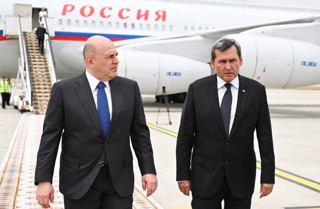 Turkmenistan CIS Government Heads Council 9171281 22.05.2026 Russian Prime Minister Mikhail Mishustin, accompanied by Turkmen Deputy Prime Minister - Foreign Minister Rashid Meredov, arrives at Ashgabat International Airport, Turkmenistan. Alexander Miridonov Sputnik Ashgabat Turkmenistan  Copyright: xAlexanderxMiridonovx