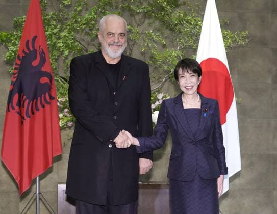 Japan-Albania talks Japanese Prime Minister Sanae Takaichi (R) shakes hands with her Albanian counterpart Edi Rama before their talks at the premier s office in Tokyo on May 22, 2026.  A14AA0005598338P