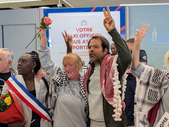 Protesters welcome returned Global Sumud Flotilla activists at Paris airport PARIS, FRANCE - MAY 22: Protesters welcome the Global Sumud Flotilla’s repatriated activists at the Roissy Charles de Gaulle Airport in Paris, France on May 22, 2026. Luc Auffret Anadolu Paris France. Editorial use only. Please get in touch for any other usage.  Copyright: x2026xAnadoluxLucxAuffretx