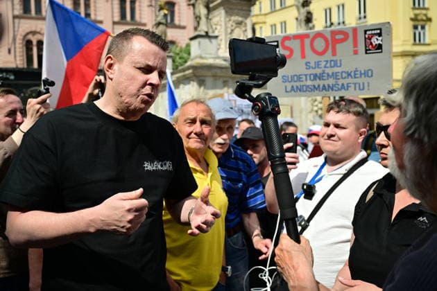 Jindrich Rajchl, left, PRO party head from SPD parliamentary club, attends a rally on Svoboda Square in Brno to express opposition to the 76th Congress of the Sudeten Germans, held for the first time in the Czech Republic, in Brno, Czech Republic, on May 22, 2026. At the right is activist Vojtech Psenak. (CTKxPhoto VaclavxSalek) CTKPhotoP2026052205015  CTKPhotoP2026052205015