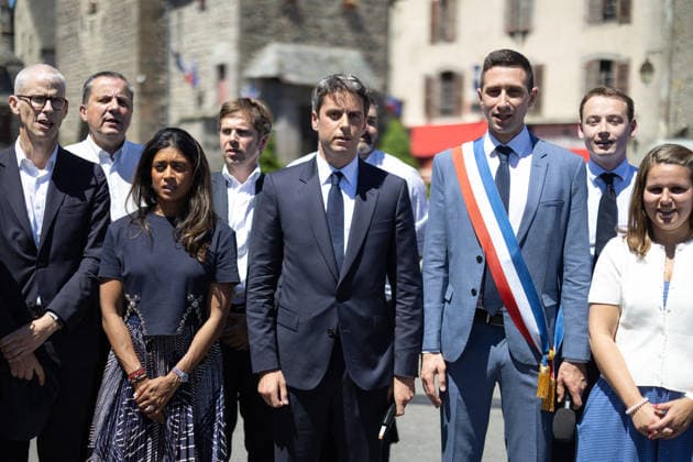 Gabriel Attal Announces his candidacy for the presidential elections - Mur-de-Barrez General Secretary of French centrist party Renaissance Gabriel Attal, Mayor of Mur-de-Barrez Pierre Ignace, Prisca Thevenot sing the Marseillaise after his speech during a visit to the village of Mur-de-Barrez in the Aveyron department, southwestern France on May 22, 2026. Former prime minister Gabriel Attal said on May 22, 2026 he was running for president next year. Photo by Raphael Lafargue ABACAPRESS.COM Mur-de-Barrez France  Copyright: xLafarguexRaphael ABACAx