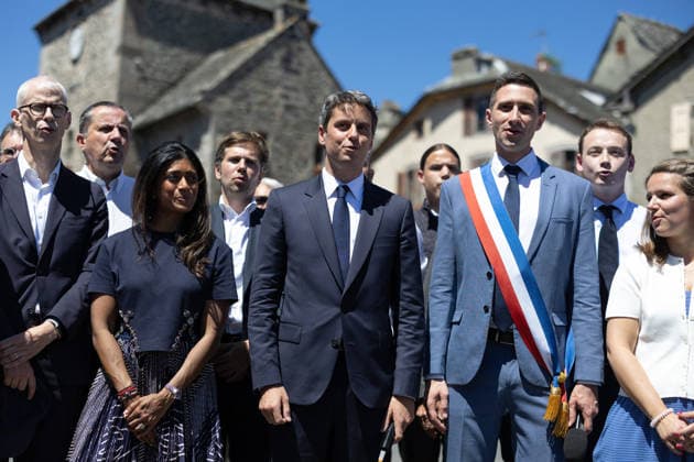 Gabriel Attal Announces his candidacy for the presidential elections - Mur-de-Barrez General Secretary of French centrist party Renaissance Gabriel Attal, Mayor of Mur-de-Barrez Pierre Ignace, Prisca Thevenot sing the Marseillaise after his speech during a visit to the village of Mur-de-Barrez in the Aveyron department, southwestern France on May 22, 2026. Former prime minister Gabriel Attal said on May 22, 2026 he was running for president next year. Photo by Raphael Lafargue ABACAPRESS.COM Mur-de-Barrez France  Copyright: xLafarguexRaphael ABACAx