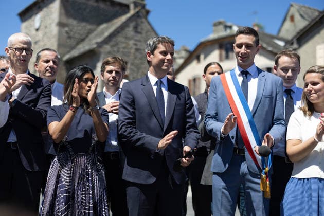 Gabriel Attal Announces his candidacy for the presidential elections - Mur-de-Barrez General Secretary of French centrist party Renaissance Gabriel Attal, Mayor of Mur-de-Barrez Pierre Ignace, Prisca Thevenot sing the Marseillaise after his speech during a visit to the village of Mur-de-Barrez in the Aveyron department, southwestern France on May 22, 2026. Former prime minister Gabriel Attal said on May 22, 2026 he was running for president next year. Photo by Raphael Lafargue ABACAPRESS.COM Mur-de-Barrez France  Copyright: xLafarguexRaphael ABACAx