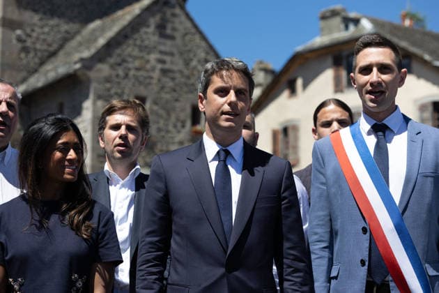 Gabriel Attal Announces his candidacy for the presidential elections - Mur-de-Barrez General Secretary of French centrist party Renaissance Gabriel Attal, Mayor of Mur-de-Barrez Pierre Ignace, Prisca Thevenot sing the Marseillaise after his speech during a visit to the village of Mur-de-Barrez in the Aveyron department, southwestern France on May 22, 2026. Former prime minister Gabriel Attal said on May 22, 2026 he was running for president next year. Photo by Raphael Lafargue ABACAPRESS.COM Mur-de-Barrez France  Copyright: xLafarguexRaphael ABACAx