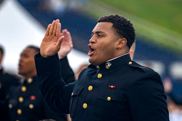 Landon Robinson takes the oath of office during the U.S. Naval Academy Graduation and Commissioning Ceremony at the U.S. Naval Academy in Annapolis, Maryland on Friday, May 22, 2026. The Naval Academy has a total of 1059 graduates.  ANN20260522324 BONNIExCASH