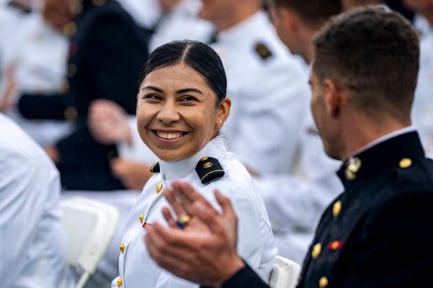 Midshipmen smile after taking the oath of office during the U.S. Naval Academy Graduation and Commissioning Ceremony at the U.S. Naval Academy in Annapolis, Maryland on Friday, May 22, 2026. The Naval Academy has a total of 1059 graduates.  ANN20260522326 BONNIExCASH