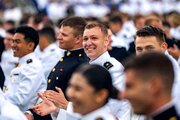 Midshipmen smile after taking the oath of office during the U.S. Naval Academy Graduation and Commissioning Ceremony at the U.S. Naval Academy in Annapolis, Maryland on Friday, May 22, 2026. The Naval Academy has a total of 1059 graduates.  ANN20260522327 BONNIExCASH