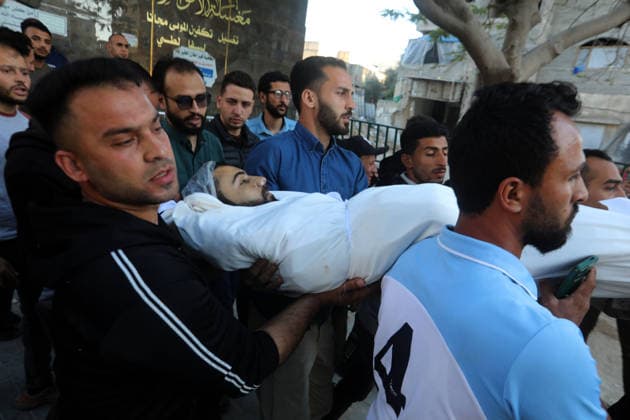 Palestinians Mourn Young Man Killed in Israeli Drone Strike in Gaza City Palestinians mourn the body of a young man who was killed in an Israeli drone strike targeting a group of civilians east of Gaza City, on May 22, 2026. According to local sources, the strike killed one Palestinian and wounded several others. Photo by Bilal Osama apaimages Gaza city Gaza Strip Palestinian Territory 220526_Gaza_BO_00(4) Copyright: xapaimagesxBilalxOsamax xapaimagesx