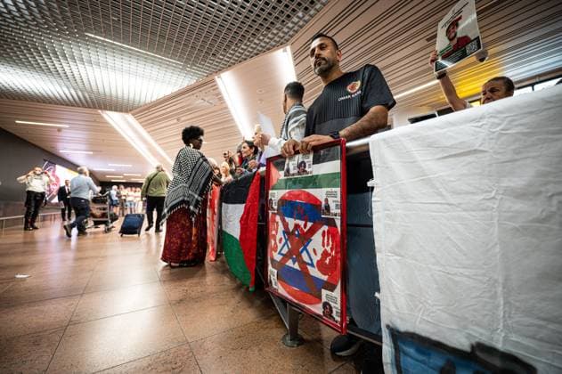 Pro-Palestinian activists pictured before Belgian activists who were part of the Gaza Flotilla arrive at Brussels Airport, in Zaventem, Friday 22 May 2026.  EMILExWINDAL 174748549