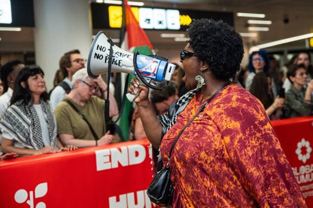 Pro-Palestinian activists pictured before Belgian activists who were part of the Gaza Flotilla arrive at Brussels Airport, in Zaventem, Friday 22 May 2026.  EMILExWINDAL 174748955