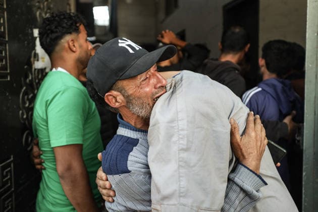 Two Palestinians were killed in Israeli attacks in Gaza GAZA CITY, GAZA, PALESTINE - MAY 22: Relatives of the 27-year-old Palestinian Loay Basal mourn as his body is brought to Al-Shifa Hospital following an Israeli military attack on the eastern part of Gaza City, despite the ongoing ceasefire, on May 22, 2026 in Gaza City, Gaza, Palestine. Two Palestinians were reported killed and several others injured as a result of continued Israeli strikes across the Gaza Strip. Khames Alrefi Anadolu Gaza City Gaza. Editorial use only. Please get in touch for any other usage.  Copyright: x2026xAnadoluxKhamesxAlrefix