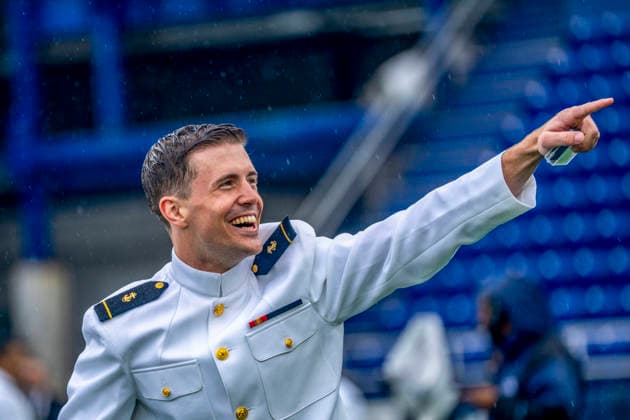 Midshipmen celebrate after receiving their diplomas during the U.S. Naval Academy Graduation and Commissioning Ceremony at the U.S. Naval Academy in Annapolis, Maryland on Friday, May 22, 2026. The Naval Academy has a total of 1059 graduates.  ANN20260522342 BONNIExCASH