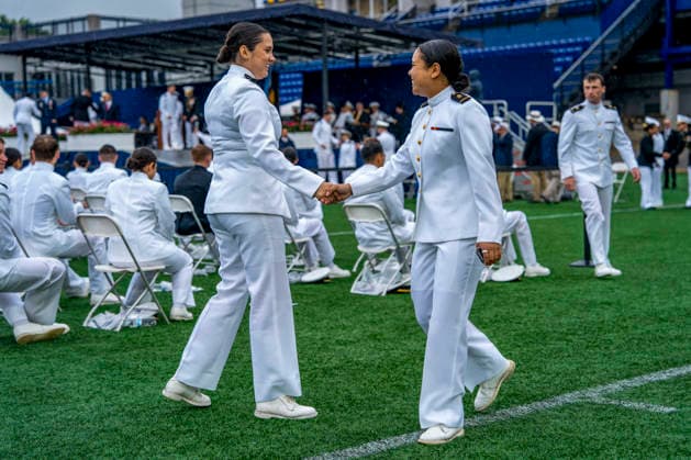 Midshipmen celebrate after receiving their diplomas during the U.S. Naval Academy Graduation and Commissioning Ceremony at the U.S. Naval Academy in Annapolis, Maryland on Friday, May 22, 2026. The Naval Academy has a total of 1059 graduates.  ANN20260522352 BONNIExCASH