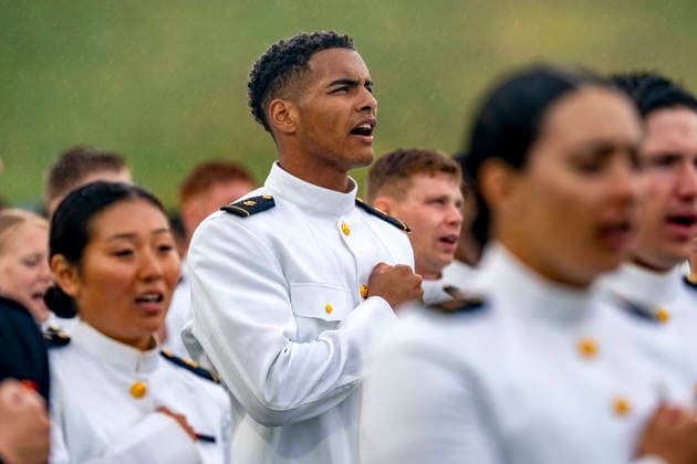 Midshipmen sing Navy Blue and Gold before tossing their caps during the U.S. Naval Academy Graduation and Commissioning Ceremony at the U.S. Naval Academy in Annapolis, Maryland on Friday, May 22, 2026. The Naval Academy has a total of 1059 graduates.  ANN20260522353 BONNIExCASH