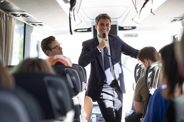 Gabriel Attal anwser journalists questions in a bus - Millau General Secretary of French centrist party Renaissance Gabriel Attal sawer journalist questions about his candidacy to the French presidency, with a microphone in a bus, as he is on his way to visit the Millau viaduct on May 22, 2026. France s former prime minister Gabriel Attal said on May 22, 2026 he was running for president next year. Photo by Raphael Lafargue ABACAPRESS.COM Millau France  Copyright: xLafarguexRaphael ABACAx