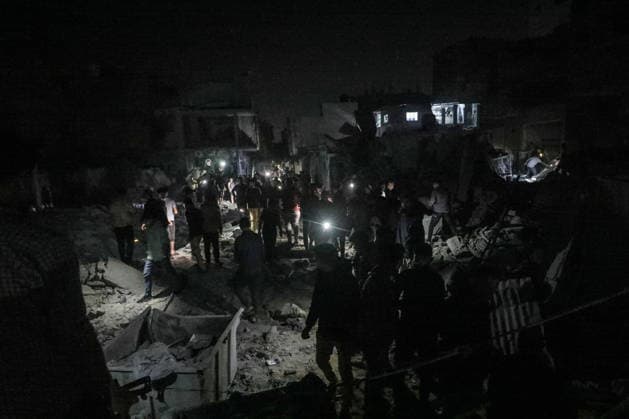 Israeli army continues attacking Gaza despite ceasefire BUREIJ, GAZA, PALESTINE - MAY 22: Palestinians inspect the destruction amid the rubble of destroyed buildings following heavy Israeli air strikes targeting the Nuseirat and Bureij refugee camps in the central Gaza Strip, Palestine on May 22, 2026. The aerial bombardments completely flattened several residential structures and caused extensive damage to neighboring homes, leaving a large number of civilians injured. Moiz Salhi Anadolu Bureij Gaza. Editorial use only. Please get in touch for any other usage.  Copyright: x2026xAnadoluxMoizxSalhix