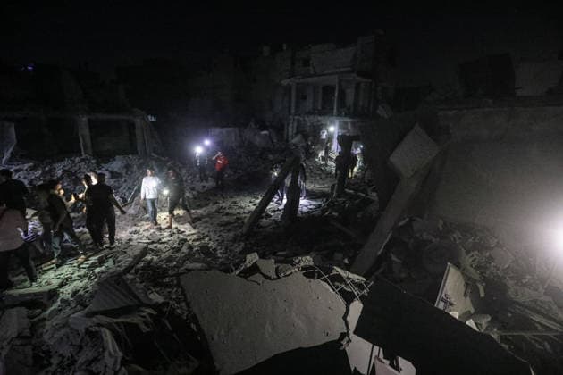 Israeli army continues attacking Gaza despite ceasefire BUREIJ, GAZA, PALESTINE - MAY 22: Palestinians inspect the destruction amid the rubble of destroyed buildings following heavy Israeli air strikes targeting the Nuseirat and Bureij refugee camps in the central Gaza Strip, Palestine on May 22, 2026. The aerial bombardments completely flattened several residential structures and caused extensive damage to neighboring homes, leaving a large number of civilians injured. Moiz Salhi Anadolu Bureij Gaza. Editorial use only. Please get in touch for any other usage.  Copyright: x2026xAnadoluxMoizxSalhix