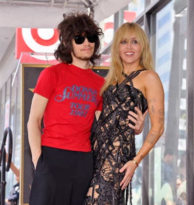 American singer, songwriter and actress Miley Cyrus (R) is joined by her fiance, musician Maxx Morando during an unveiling ceremony honoring her with the 2,845th star on the Hollywood Walk of Fame in Los Angeles on Friday, May 22, 2026.  LAP2026052223 JIMxRUYMEN