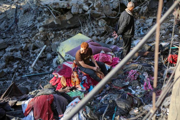 Israeli army continues attacking Gaza despite ceasefire GAZA CITY, GAZA, PALESTINE - MAY 22: Palestinians inspect the destruction amid the rubble of buildings following Israeli military strikes targeting the Abu Saif family home despite the ongoing ceasefire in Nuseirat Refugee Camp, Gaza City, Gaza, Palestine on May 22, 2026. Hassan Jedi Anadolu Gaza City Gaza. Editorial use only. Please get in touch for any other usage.  Copyright: x2026xAnadoluxHassanxJedix