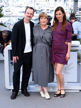 IPA84989332 - Cannes, 79th Cannes Film Festival 2026 - Day 12. Das Geträumte Abenteuer (The Dreamed Adventure). Pictured are Jonas Dornbach, Valeska Grisebach and Janine Jackowski.  Copyright: xAlbertoxTerenghix xPoolxPhotoxEventsx07x 84989332