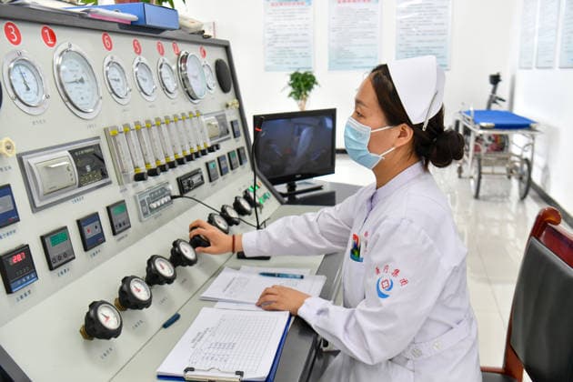 (260523) -- QINYUAN, May 23, 2026 -- A nurse monitors the injured workers receiving oxygen therapy at a hospital in Qinyuan County, north China s Shanxi Province, May 23, 2026. The coal mine accident in north China s Shanxi Province has left 82 people dead, with nine others still unaccounted for, according to the county s emergency management bureau. The gas explosion occurred on Friday at the Liushenyu coal mine in Qinyuan County. The province has sent 755 people including rescuers and medical personnel to the site. Rescue efforts are ongoing. A total of 123 people have been sent to hospitals for treatment, including two in critical condition and two in serious condition, while 33 others have returned home. ) (SpotNews) CHINA-SHANXI 
