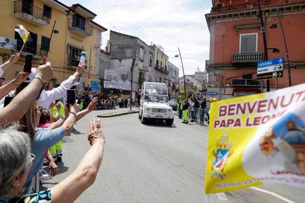 Visit of Pope Leo XIV to Acerra Along the streets of Acerra, near Naples, crowds of worshippers gathered to greet Pope Leo XIV as he passed through the town in the popemobile. Thousands of faithful lined the streets waving flags, applauding, and praying during the Pope™s pastoral visit, transforming the town into a moment of collective celebration and devotion.A deeply symbolic event marked by strong public participation and religious fervour. Acerra May 23, 2026. _BPH0562 Copyright: xAntonioxBalascox